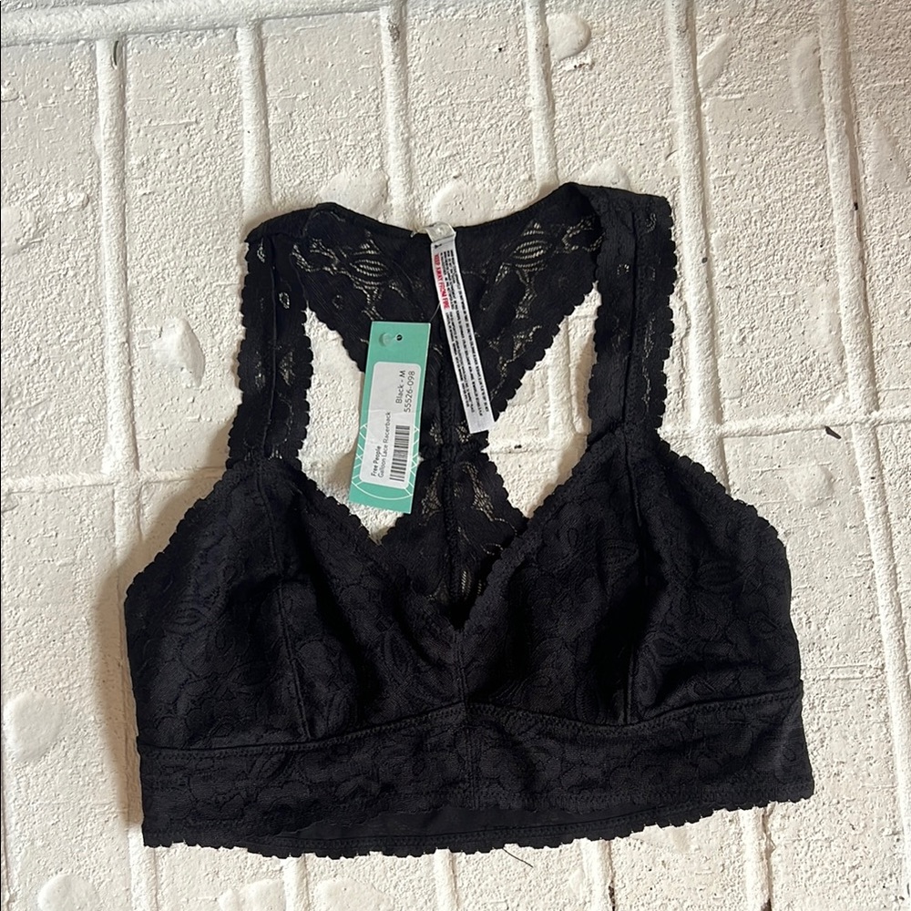 NWT Free People Galloon lace racer back tank. Color is black. Size Medium.